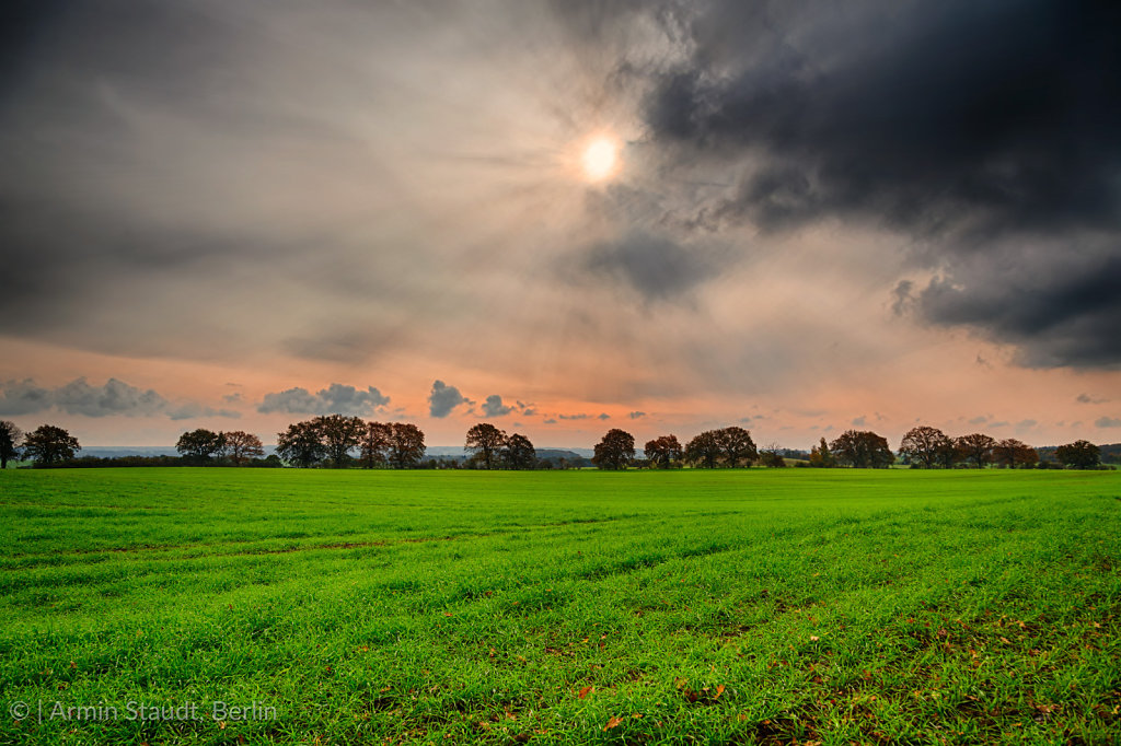 hdr shoot of a landscape with thunder clouds an the sun