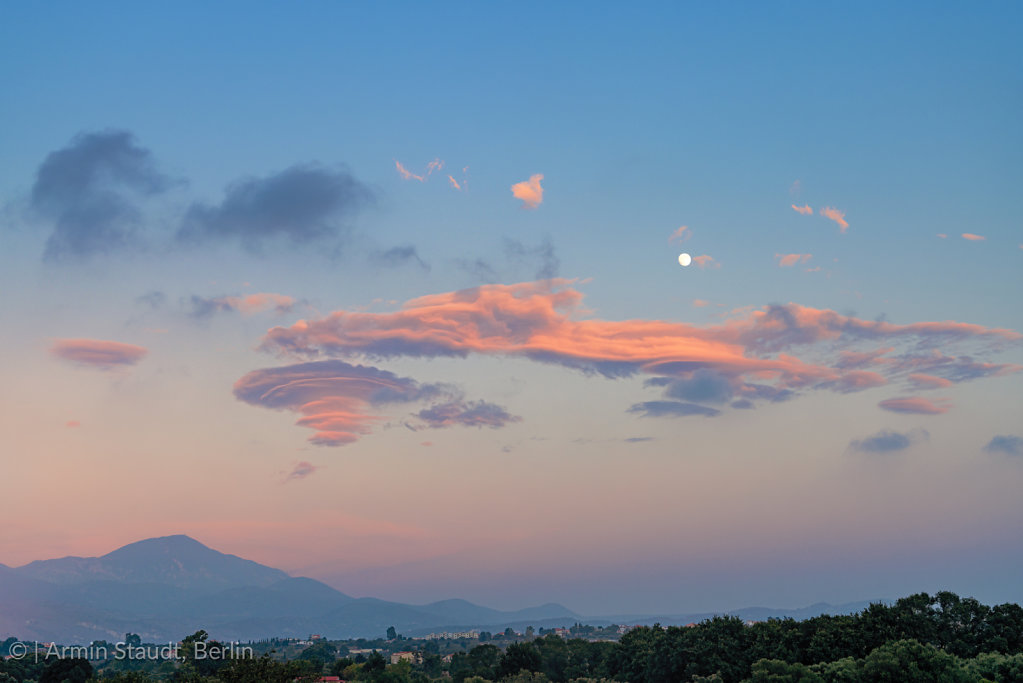 mediterranean evening landscape with the moon and cloudscape