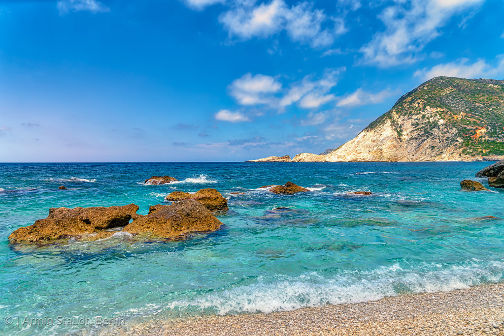 mediterranean landscape with stone beach in summer